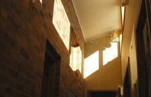 Photo of clear-story area with winter sun and a fan