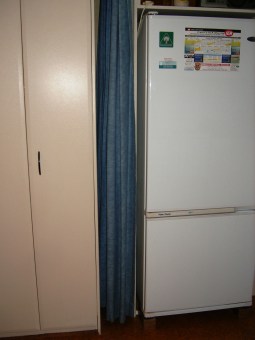 Photo of fridge and curtain