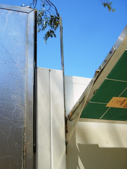 Whitco window stays form hinges to support house-warming sun mirror panels to make them also summer shade panels.