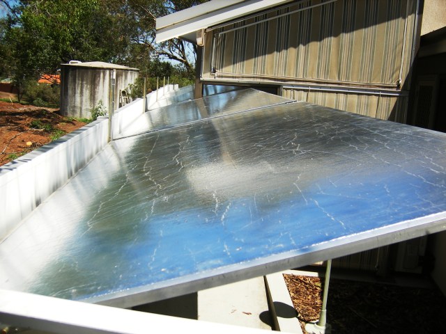 Sun mirror panels that warm the house in winter, reflect sunlight away in summer.